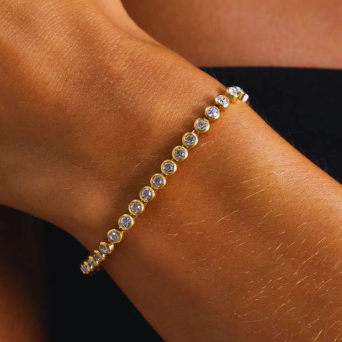 Eilyor Crystal line bracelet on wrist stacked with bangles