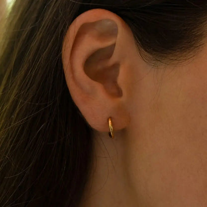Eilyor slim gold hoops 18k PVD shown on ear